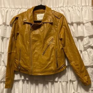 Trendy mustard color asymmetric zip faux fur moto style vegan leather jacket.
